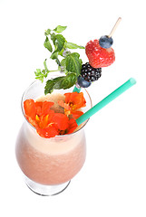 Image showing fitness cocktail with berries and flowers isolated on white