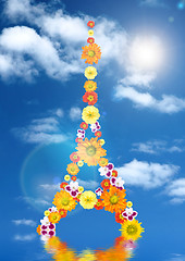 Image showing eiffel tower from flowers with reflection and sun against blue s