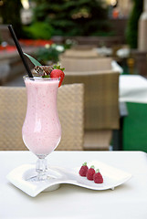 Image showing strawberry milkshake on the table