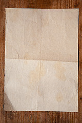 Image showing old paper on wood