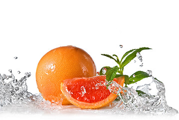 Image showing Water splash on grapefruit with mint isolated on white