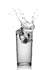 Image showing water splash in glass isolated on white