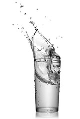 Image showing water splash in glass isolated on white