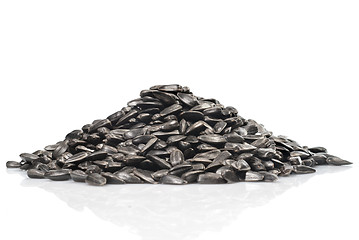 Image showing pile of black sunflower seeds isolated on a white background