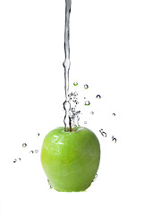 Image showing fresh water splash on green apple isolated on white