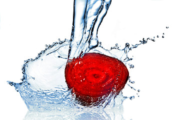 Image showing red beet with water splash isolated on white