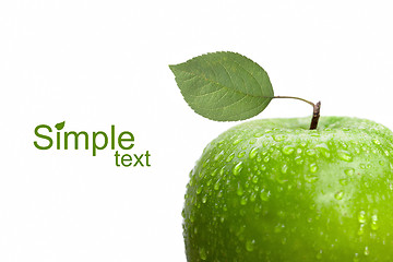 Image showing green apple with leaf and water drops isolated on white