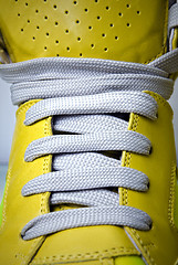 Image showing close-up laces on the yellow boots