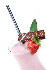 Image showing strawberry milkshake with straw isolated on white