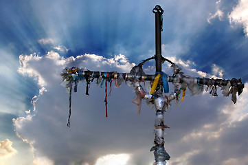 Image showing Cross with ribbons against clouds