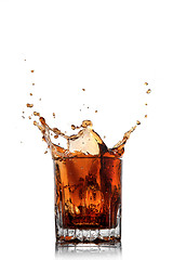 Image showing splash of cola in glass isolated on white