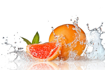 Image showing Water splash on grapefruit with mint isolated on white