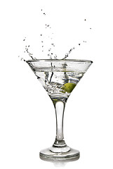 Image showing martini with olive and splash isolated on white