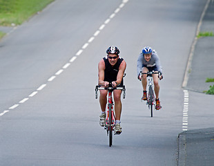 Image showing Triathletes racing