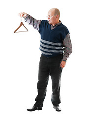 Image showing Confident man in glasses holds empty cloth hanger