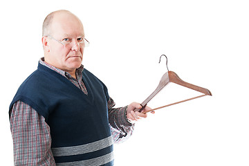 Image showing Confident man in glasses holds in hand empty cloth hanger