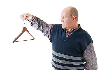 Image showing Confident man in glasses holds in hand empty cloth hanger