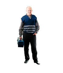 Image showing Confident man standing with toolbox in right hand