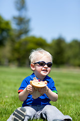 Image showing toddler eating sandwich
