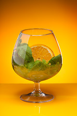 Image showing Glass with mint and orange drink