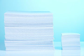 Image showing Big and small paper piles
