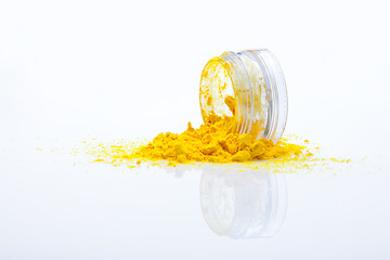 Image showing spilled yellow makeup powder