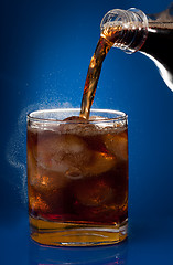 Image showing Filling glass with cola