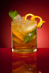 Image showing Orange drink with ice and mint