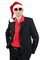 Image showing businessman in the Santa hat and sunglasses