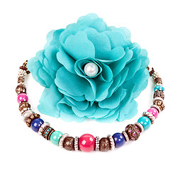 Image showing turquoise fabric flower and color bracelet