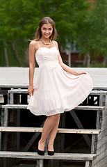 Image showing girl on the stairs in a dress