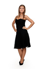 Image showing tanned girl in a black dress