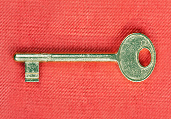 Image showing old golden key to the door