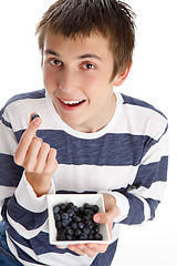 Image showing Healthy life - eating blueberries