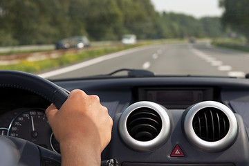 Image showing Driving a car