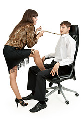 Image showing she pulls a businessman tie