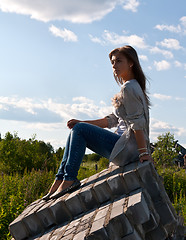 Image showing beautiful girl sitting on the ruins