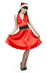 Image showing girl in a red dress and hat santa