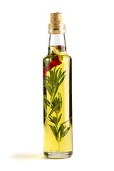 Image showing Olive oil with rosemary, garlic and pepper.