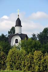 Image showing White Chapel Surrounded by Green Trees