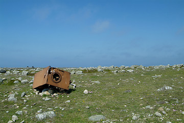 Image showing Rusty junk on grass