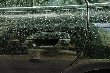 Image showing Water drops on car lateral side