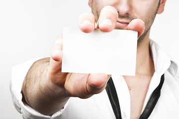 Image showing Sexy businessman showing his businesscard