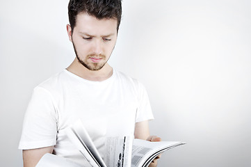 Image showing Young man reading a book