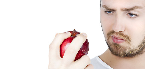 Image showing Man staring at an apple