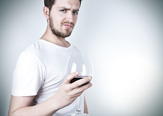 Image showing Young Man Posing with Wine