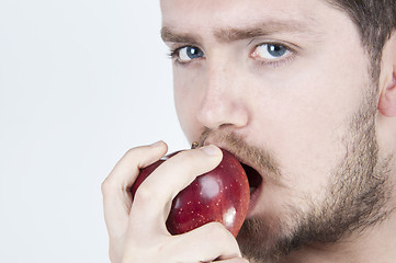 Image showing Young Man Eating Apple