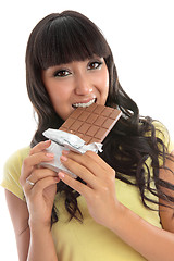 Image showing Beautiful girl eating a block of chocolate