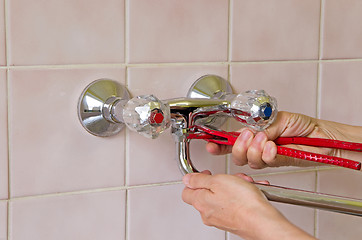 Image showing plumber and tap