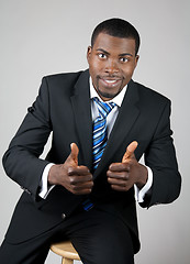 Image showing Smiling successful businessman with thumbs up